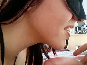 She sucks on large testicles while getting ready for doggystyle action