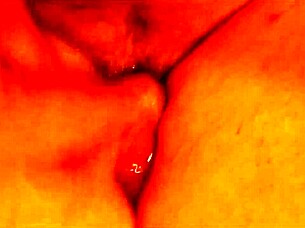 Shemale performs self-urination act.