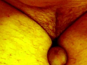 Shemale performs self-urination act.