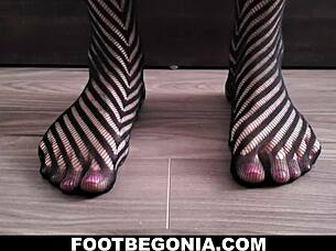 Pretty toes in black stockings for foot fetish close-up