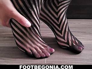 Pretty toes in black stockings for foot fetish close-up