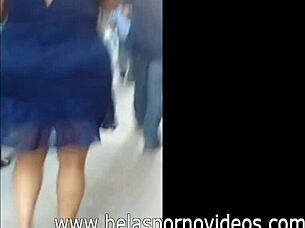 Mature woman in blue dress feels aroused