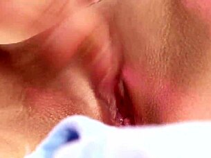 Demi A plays with her blue dildo toy