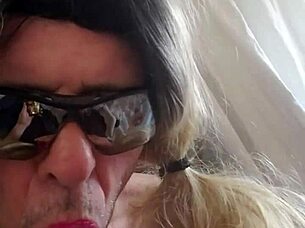 she explores various dildos while wearing lingerie in a playful session