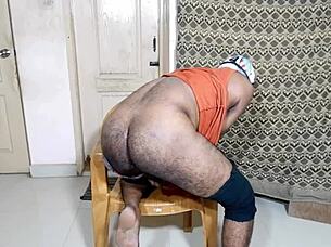 a nice big ass gently inserting a small black toy in a relaxed setting