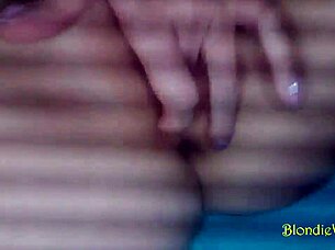 This amateur hot blonde in stockings is fingering her shaved pussy, and it's driving me crazy with desire