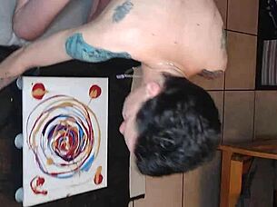 Naked painting session continues with artistic focus