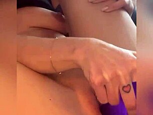 that babe is squirting hard from the purple dildo closeup