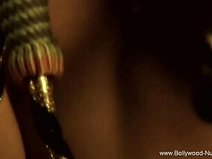a sensual brunette from bollywood dances nude, teasing with erotic softcore moves in an asian-inspired scene.
