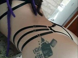 Purple-haired beauty dances on the desk