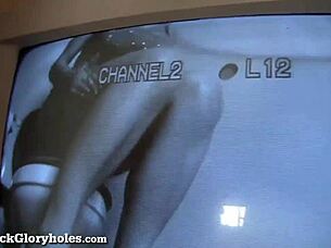 Busty blonde sucks strangers cock at gloryhole with handjob.