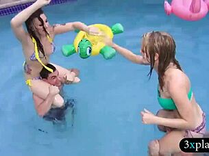 Two girls in bikinis by the pool