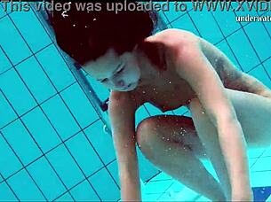 Nata, the hot Hungarian babe, enjoys swimming in the public pool with friends