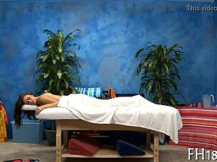 Sensual naked massage session with hot oils and relaxing touches on bare skin.