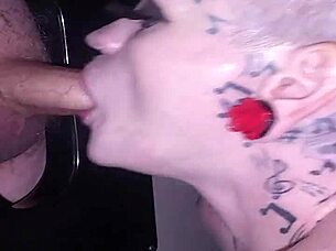 Lyrik Allure Performs Sloppy Blowjob Through Gloryhole, Receives Facial Cumshot on Her Hairless Body