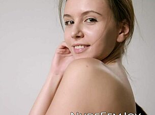 naturally busty beauty shows off her big natural tits and hairless pussy