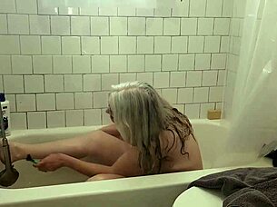 hey, check out momma vee shaving her pussy smooth and then playing with herself in the shower, those big natural tits bouncing