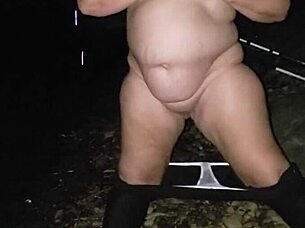 Stripping at river with clothes ripped intensely