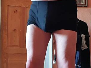 The German girl strips, ripping her clothes off in a seductive undressing scene.