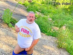 A fat fireman enjoys being watched