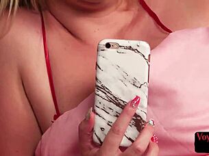 She watches and teases the jerker with her big tits.