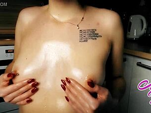 Very Cute Girl Tenderly Massages Her Natural Tits With Oil, Feeling The Warmth