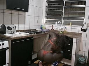 Brazilian housewife teases in red lingerie while cleaning.