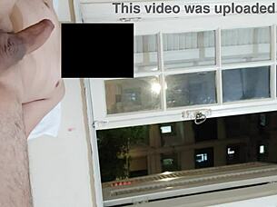 flashing cock at open window for neighbors