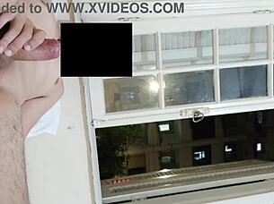 flashing cock at open window for neighbors