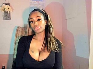 Tattooed milf with big tits playing with her pussy!