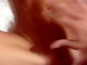 a homemade pov video of a blonde amateur on the bed