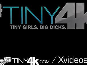 tiny blonde hockey fan enjoys big stick game