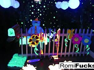 Romi rain and dani engage in lesbian fun under black lights, exploring big tits and pussies