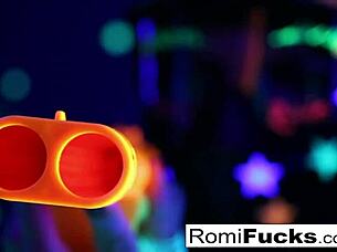 Romi rain and dani engage in lesbian fun under black lights, exploring big tits and pussies