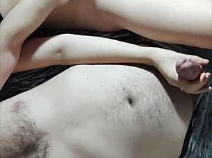 Pretty couple engages in mutual masturbation at home