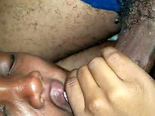 Ebony slut deepthroats boyfriend's big dick