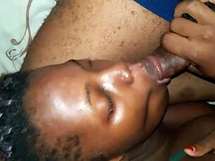 Ebony slut deepthroats boyfriend's big dick