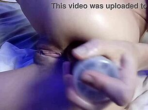 This video features intense anal fisting on a petite girl.