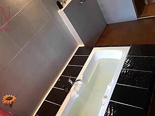 Housewife shaves pussy in bath, kinky voyeur scene