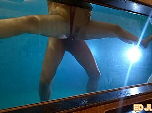 Brunette teases Ed Junior with underwater blowjob.