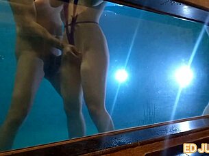 Brunette teases Ed Junior with underwater blowjob.