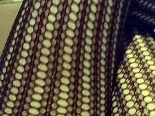 Fetish Model in Stockings Poses for Detailed Close-Up Shots