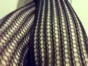 Fetish Model in Stockings Poses for Detailed Close-Up Shots