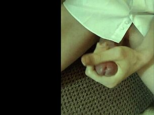 guy in white shirt casually wanks off in everyday setting