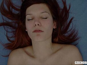 Redhead soloist teases her plump pussy lips