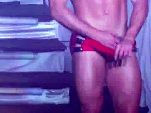 Watch handsome Brazilian stripper rip clothes in wild striptease!