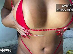 Hot girl experimenting with new micro bikinis on the beach.