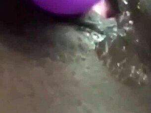 The ebony babe uses a huge vibrator for homemade masturbation and squirting.