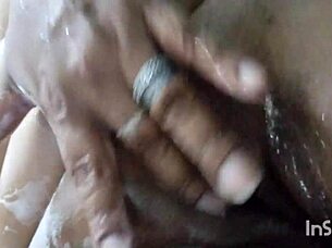 Amateur uses dildo in the shower for massage