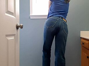 Wetting tight denim jeans in bathroom with panties